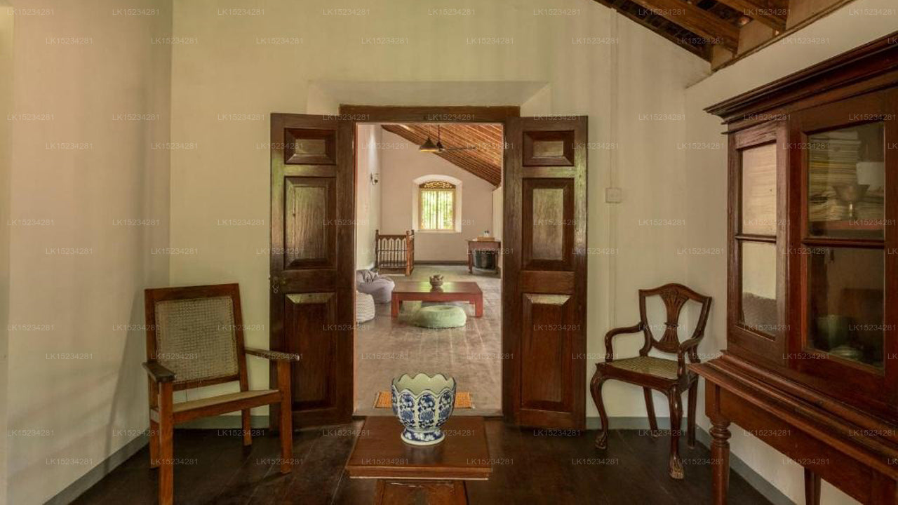 Vintage-style room with wooden furniture and a large mirror.