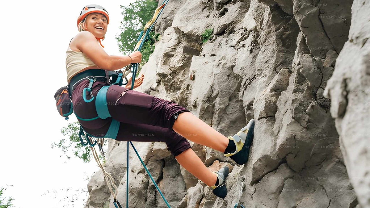 Person rock climbing on a rocky cliff